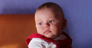 Portrait of cute adorable baby boy outside observing the world