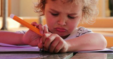 Upset Little boy angry doing grimaces with face and mouth