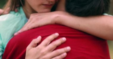 Empathic hug, two young women embracing each other close-up. Support empathy concept