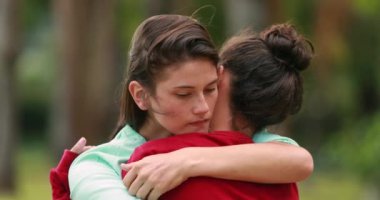 Female friends hugging each other. Women empathic listening and embrace