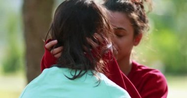 Woman hugging friend empathically. Girlfriend embracing and understanding friendship