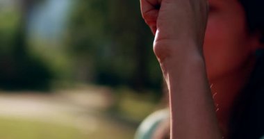 Girlfriends joining hands in support outdoors at park