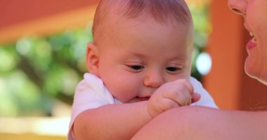 Tired Cute sleepy newborn baby outdoors