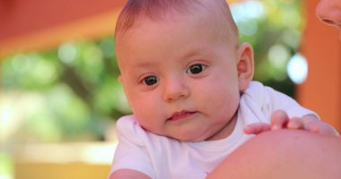 Tired Cute sleepy newborn baby outdoors