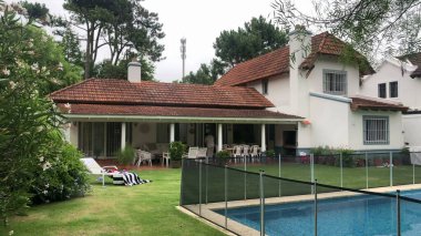 Residential home exterior backyard with swimming pool