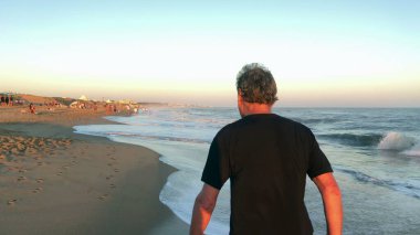 Person walking at the beach