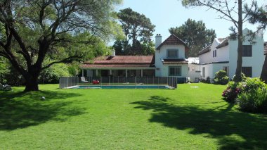 Beautiful home exterior. Establishing shot of house in sunny day