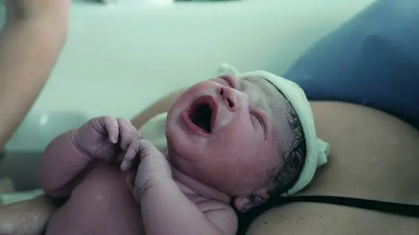 stock image First Moments of a Newborn Crying at Birth, Emphasizing the Infant's Initial Breaths and Early Life