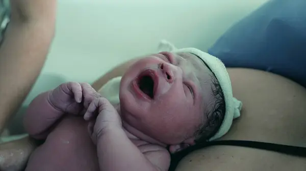 stock image First Moments of a Newborn Crying at Birth, Emphasizing the Infant's Initial Breaths and Early Life