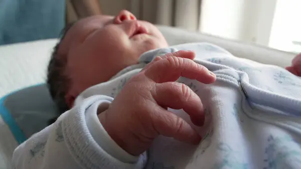 stock image Newborn baby tiny hands macro close-up during first days of life. cute infant's detail hand, initial week stage of life