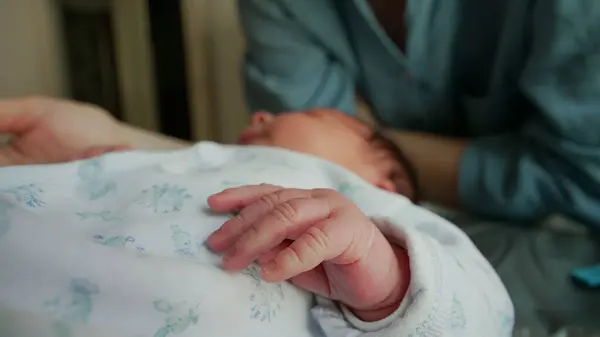 stock image Close-up of a newborn's hand with soft, tiny fingers, capturing the delicate and tender nature of early life. the fragility and beauty of infancy 