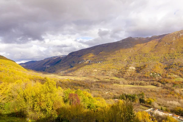 stock image The colored mountains in autumn with the cloudy sky in the province of Rieti. Italy.