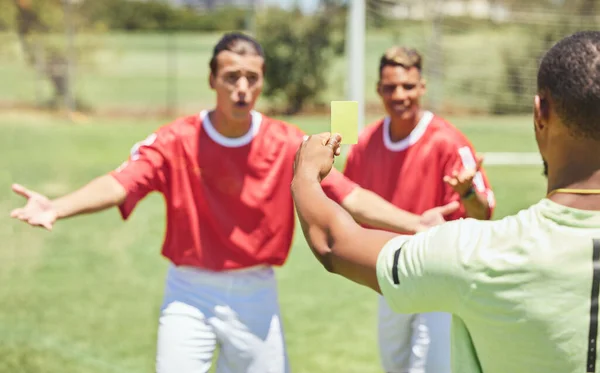 Man, soccer player and yellow card from referee for sports foul, misconduct or unfair play on the field. Confused men in soccer match getting a warning, sign or penalty for fail in football game law.
