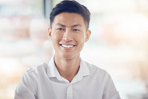 Asian, businessman and portrait smile with happy vision for success against a bokeh background. Successful japanese male smiling with teeth in happiness for company plan, idea or goal at the office.