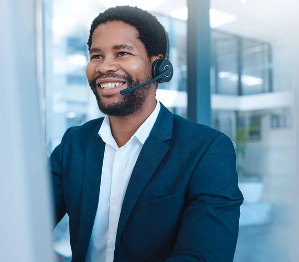 stock image Call center, communication and black man consulting on the internet with a computer in an office at work. Happy, crm and African customer service worker working in telemarketing and support online.
