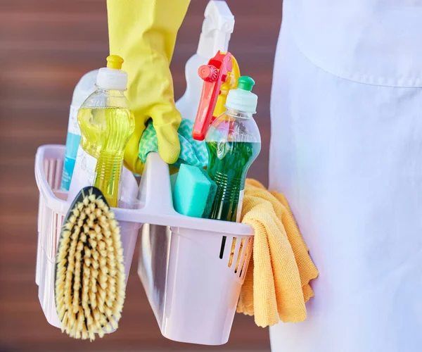 Cleaning, tools and cleaner carrying basket with liquid soap, brush and detergent spray bottle. Closeup of products for washing, hygiene and clean supplies for housekeeper, maid or domestic worker.