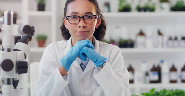 Science is a discipline that can help grow the future. Portrait of a young scientist working in a lab