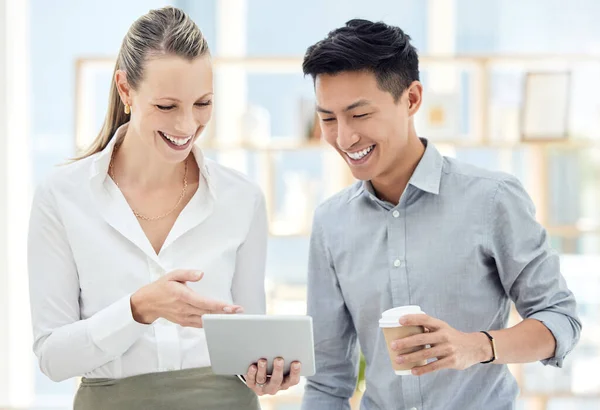 Tablet, teamwork and communication with a business woman and asian man talking or planning in their office. Meeting, strategy and collaboration with a male and female employee working on strategy.