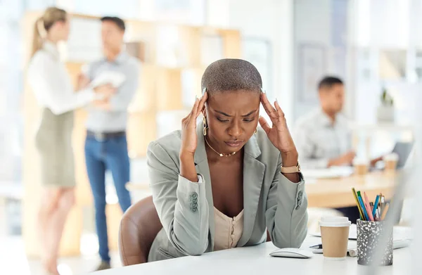 Black woman, stress and headache being overworked, experience burnout and frustrated with work at desk in office. Female employee, girl and business with mental health, feeling pain and exhausted