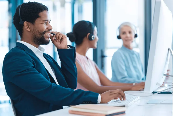 Support, consulting and a black man and woman in call center with headset and computer, help in customer service. Crm, telemarketing and sales for corporate communication employee talking online.