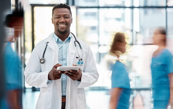 Black man, doctor and healthcare, hospital and tablet for communication with technology and digital medical information. Health insurance, professional and smile in portrait, stethoscope at clinic