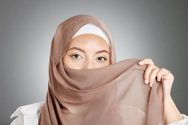 Muslim, hijab and eyes of woman for beauty, makeup and cosmetics on studio mock up marketing or advertising. Islamic, arabic fashion model girl and cloth cover face in skin cosmetic portrait headshot.