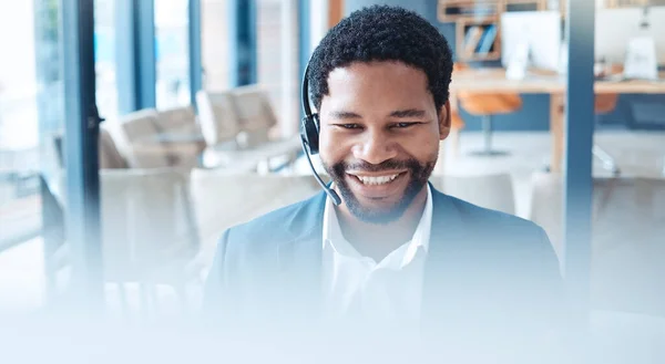 Telemarketing, call center and black man with smile, communication and discussion in office or workspace. African American consultant, business agent and consultation for advice and online webinar.