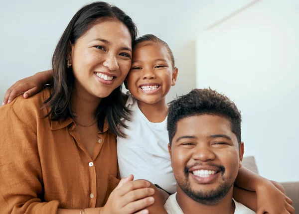 stock image Happy family, mother and father with child in a portrait enjoying quality time with big smiles on their faces. Young kid, mama and dad love relaxing together on a living room sofa in a house in Peru.