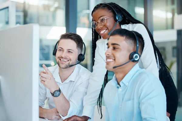 Customer service, call center or telemarketing team and manager or mentor looking happy reading online feedback or sale on website. Diversity in CRM, support and sales consultant training office.