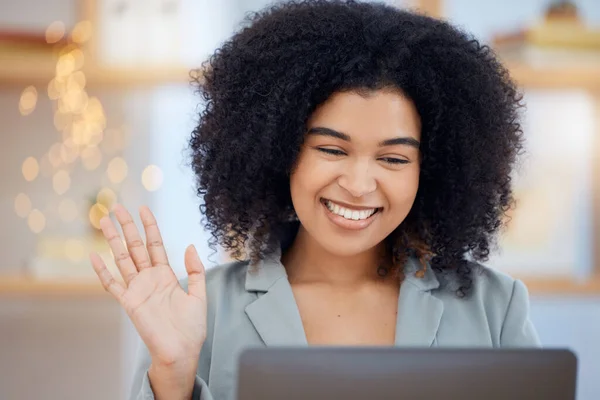 Wave, video call and communication with a black woman in business networking on a laptop in her office at work. Computer, internet and video conference with a female employee in a remote meeting.