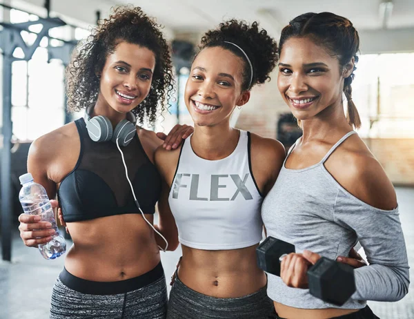 Buddy up and be your best. a group of happy young women enjoying their time together at the gym