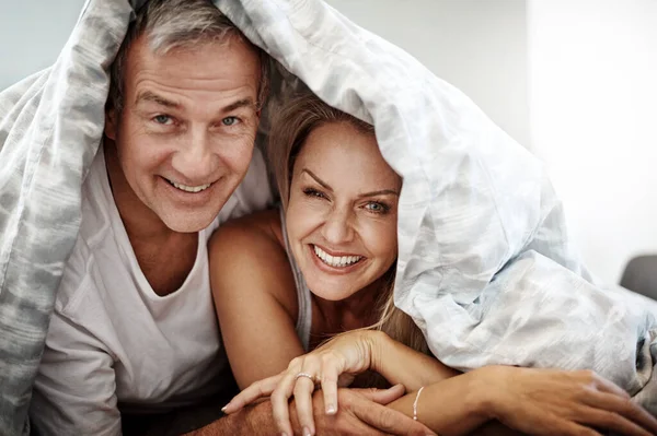 stock image We love a weekend lie-in. an affectionate couple spending the day in bed