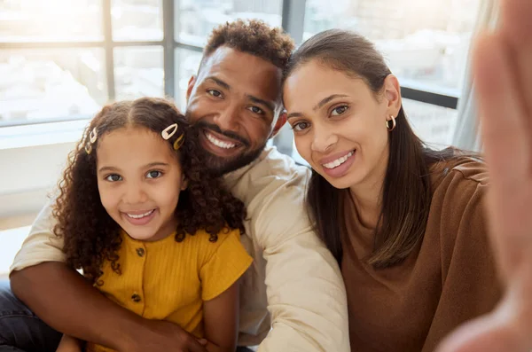 Black family, selfie and happiness of a mother, father and girl bonding together at home. Portrait of a happy mama, dad and child with quality time, parents love and a hug showing care at a house.