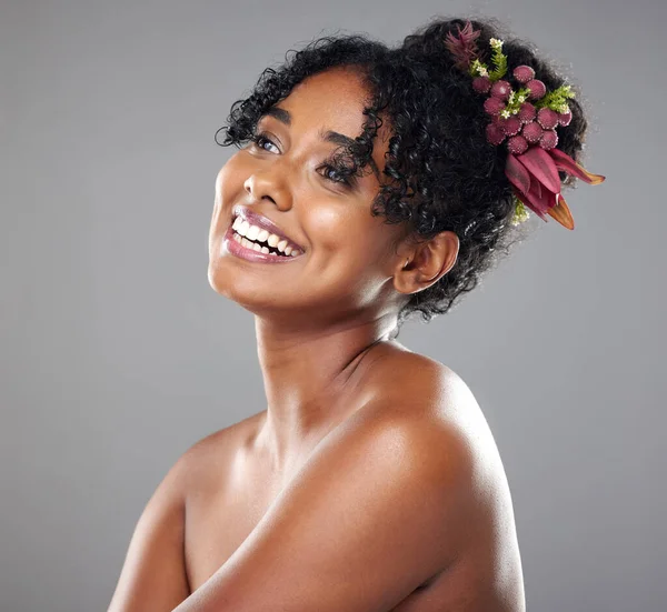 Black woman, beauty skincare smile with healthy happy glow on body and cosmetics face against studio wall. Makeup model girl, natural shine on skin wellness and health with dark background in Atlanta.