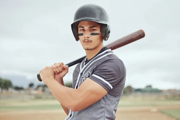 Man, baseball player and sports bat for game, match or training on the pitch in the outdoors. Professional male in baseball for competitive sport ready to play ball for fitness, exercise or workout.