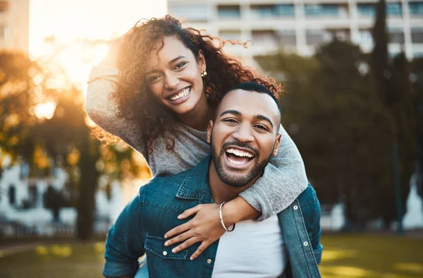 Stock image Their hearts are brimming with bliss. Portrait of a young couple having fun together outdoors