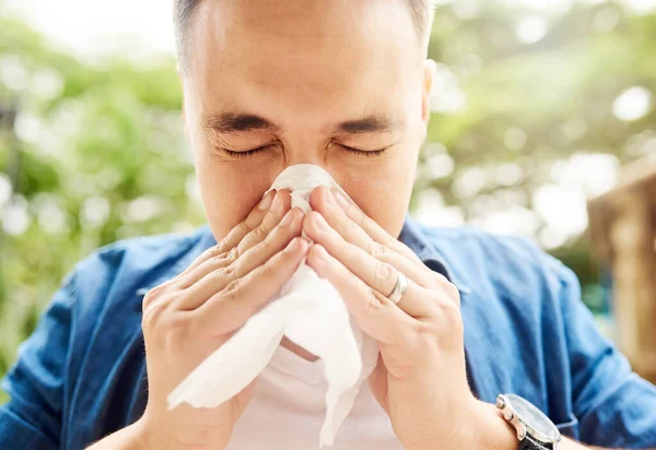 Suffering Allergies Young Man Blowing His Nose While Out Park — Stock Photo, Image