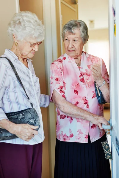 Must Make Sure Its Locked Two Elderly Woman Closing Door Stock Picture