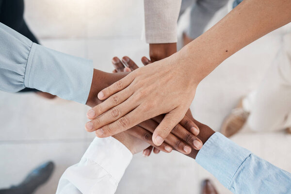 Collaboration, team building and diversity stack hands together for support, career motivation and company goal. Corporate community and professional group hand sign for solidarity mission above.