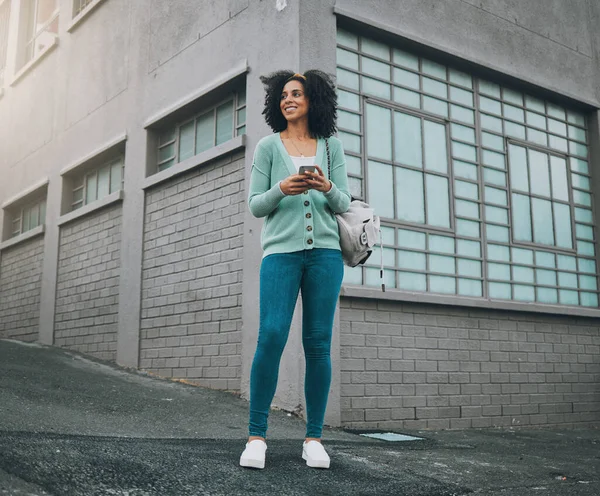 Black woman, fashion and city travel with phone for location gps, internet map or social media on New York street or road. Smile, happy or cool student or tourist on 5g mobile technology for taxi app.