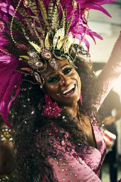 stock image Performing live brings a smile to my face. Cropped portrait of a beautiful samba dancer performing at Carnival with her band