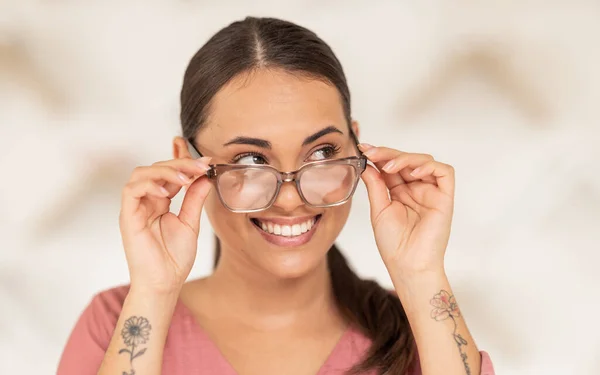 Glasses, vision and thinking with a woman customer in an optometry store to buy prescription lenses. Eyewear, idea and retail with a female consumer shopping for frame spectacles at an optometrist.