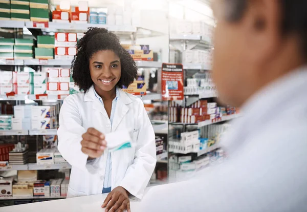 Give You Instant Relief Attractive Young Female Pharmacist Helping Customer — Stock Photo, Image
