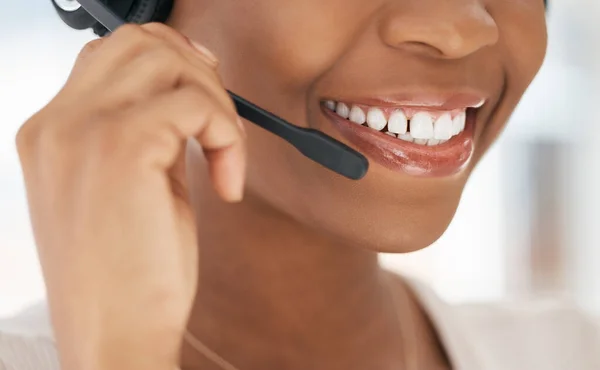 Stock image Black woman, call center and microphone for customer service agent, working or conversation to help, smile or advice. African American female, girl or discussion with client speaking or telemarketing.