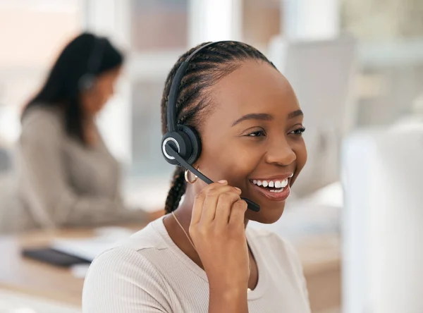 Black woman, customer support agent and sales employee with a smile working at digital call center or online telemarketing insurance business. Crm consultant at office desk, helping client and happy.