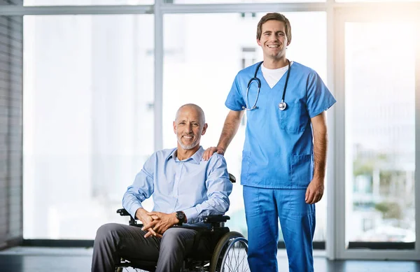The kind of care I can depend on. Portrait of a male nurse caring for a senior patient in a wheelchair