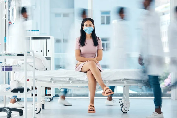 Covid face mask, woman or doctors in busy hospital for medical wellness, healthcare life insurance or bacteria test. Portrait, waiting or covid 19 patient in safety, security or compliance.