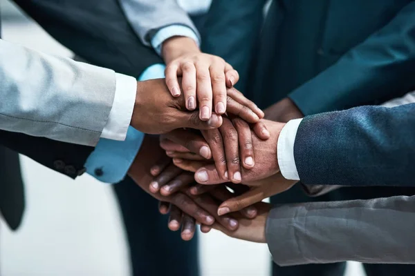 stock image We can do it with everyones support. Closeup shot of a group of businesspeople joining their hands together in unity