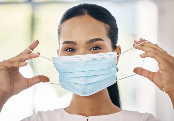 Face mask, woman and covid healthcare for medical protection, professional safety and covid 19 pandemic vaccine center. Healthcare, a worker with mask and clinic at coronavirus virus treatment clinic.