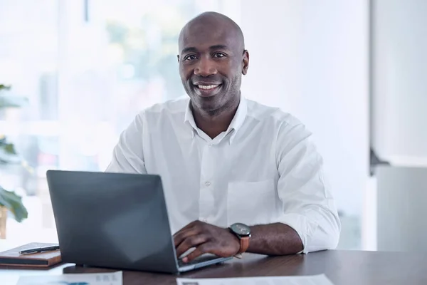 Ceo, black man and portrait at office laptop with smile working on report for marketing company. Professional corporate worker at workplace desk with document for project development
